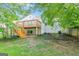 Back of house with deck and stairs to backyard at 489 Radar Dr, Hapeville, GA 30354