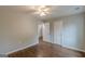 Bedroom with hardwood floors, a ceiling fan, and two doors at 489 Radar Dr, Hapeville, GA 30354