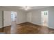 Bedroom showcasing hardwood floors, neutral walls, and access to a bathroom at 489 Radar Dr, Hapeville, GA 30354