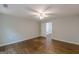 Spacious bedroom featuring hardwood floors and a white ceiling fan at 489 Radar Dr, Hapeville, GA 30354