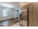 Eat-in kitchen with stainless steel refrigerator, updated cabinetry and hardwood floors at 489 Radar Dr, Hapeville, GA 30354