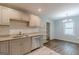 This spacious kitchen features stainless appliances, granite counters, and stylish backsplash at 489 Radar Dr, Hapeville, GA 30354