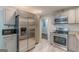 Well-equipped kitchen featuring stainless steel appliances, granite countertops, and neutral finishes at 489 Radar Dr, Hapeville, GA 30354