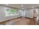 Bright living room with hardwood floors, large windows, and neutral paint, creating a welcoming atmosphere at 489 Radar Dr, Hapeville, GA 30354