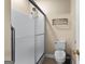 Bathroom features a walk-in shower, tile floor, and modern toilet at 130 Augusta Dr, Peachtree City, GA 30269