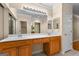 Bathroom features double sinks, tile floor, neutral walls, vanity and plenty of mirrors at 130 Augusta Dr, Peachtree City, GA 30269