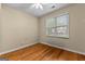 Cozy bedroom with hardwood flooring, natural light, and neutral walls at 130 Augusta Dr, Peachtree City, GA 30269