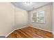 Simple bedroom with hardwood flooring and window view at 130 Augusta Dr, Peachtree City, GA 30269