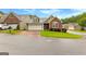 Beautiful home with two-car garage, well-manicured lawn, and inviting curb appeal at 130 Augusta Dr, Peachtree City, GA 30269