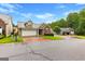 Charming home with a well-manicured lawn, two-car garage, and convenient circular driveway at 130 Augusta Dr, Peachtree City, GA 30269