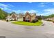 Charming home exterior with well-kept lawn, attached garage, and inviting curb appeal in a friendly neighborhood at 130 Augusta Dr, Peachtree City, GA 30269
