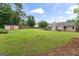 Large, green backyard with shed and privacy fence provides ample space for recreation and relaxation at 200 Pine Tree Ln, Mcdonough, GA 30252
