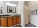 Clean bathroom with vanity, a tub shower with floral shower curtain and plenty of light at 200 Pine Tree Ln, Mcdonough, GA 30252