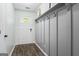 Inviting entryway featuring coat hooks, wood-look floors, and natural light at 200 Pine Tree Ln, Mcdonough, GA 30252