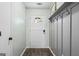 Bright foyer featuring coat hooks and wood-look floors at 200 Pine Tree Ln, Mcdonough, GA 30252