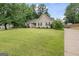 Traditional-style home featuring a spacious front yard and inviting curb appeal at 200 Pine Tree Ln, Mcdonough, GA 30252