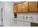 Bright kitchen with wood cabinets, granite countertops, and white accents at 200 Pine Tree Ln, Mcdonough, GA 30252