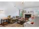 Inviting living room with ample seating, brick fireplace, and natural light at 200 Pine Tree Ln, Mcdonough, GA 30252