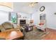 Spacious living room featuring fireplace, hardwood floors, and ample seating at 200 Pine Tree Ln, Mcdonough, GA 30252