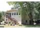 The back exterior of the home, including stairs to a covered patio at 9342 Carillon Ct, Jonesboro, GA 30236