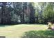 Large, well maintained backyard with shade trees at 9342 Carillon Ct, Jonesboro, GA 30236