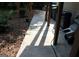 Back porch with outdoor lighting, trash receptacles, and grill at 9342 Carillon Ct, Jonesboro, GA 30236