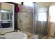 Bathroom featuring glass enclosed shower and soaking tub at 9342 Carillon Ct, Jonesboro, GA 30236