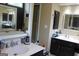Bathroom featuring double sink vanity with dark cabinets at 9342 Carillon Ct, Jonesboro, GA 30236
