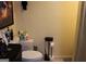 Bathroom features include a toilet, toilet paper holder, and some decorations at 9342 Carillon Ct, Jonesboro, GA 30236