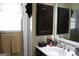 Bathroom featuring single sink vanity with dark cabinets at 9342 Carillon Ct, Jonesboro, GA 30236