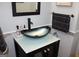 Modern bathroom vanity with a unique, sleek vessel sink and stylish fixtures at 9342 Carillon Ct, Jonesboro, GA 30236