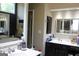 Bathroom featuring double sink vanity with dark cabinets at 9342 Carillon Ct, Jonesboro, GA 30236