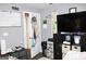 Bedroom featuring hardwood floors, and entertainment center with a flat screen TV at 9342 Carillon Ct, Jonesboro, GA 30236