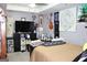 Bedroom with a large bed and a dark entertainment center with a flat screen television at 9342 Carillon Ct, Jonesboro, GA 30236