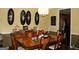 Spacious dining room with a large wooden dining table and chair set at 9342 Carillon Ct, Jonesboro, GA 30236