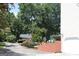 The driveway leading to the house, surrounded by trees and landscaped plants at 9342 Carillon Ct, Jonesboro, GA 30236