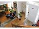 View of the home's foyer and front door with hardwood floors at 9342 Carillon Ct, Jonesboro, GA 30236