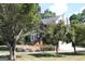 A two-story brick home showcases mature landscaping and inviting curb appeal at 9342 Carillon Ct, Jonesboro, GA 30236