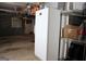 View of a garage featuring a refrigerator and shelving units at 9342 Carillon Ct, Jonesboro, GA 30236