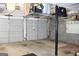 Spacious garage with overhead storage racks and gray paneled doors for convenient access at 9342 Carillon Ct, Jonesboro, GA 30236
