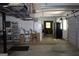 A functional garage featuring overhead storage, utility access, and ample space at 9342 Carillon Ct, Jonesboro, GA 30236