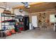 Functional garage featuring overhead door, shelving, and space for various items at 9342 Carillon Ct, Jonesboro, GA 30236