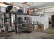Well-equipped garage with shelving, overhead storage, and utility equipment at 9342 Carillon Ct, Jonesboro, GA 30236