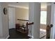 Upper hallway with railing, table and decor at 9342 Carillon Ct, Jonesboro, GA 30236
