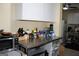 Kitchen features a stainless steel table, microwave, and cabinets at 9342 Carillon Ct, Jonesboro, GA 30236
