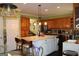 Open kitchen featuring a large island with seating and plenty of natural light at 9342 Carillon Ct, Jonesboro, GA 30236