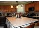 Modern kitchen featuring a large center island with seating and stainless steel appliances at 9342 Carillon Ct, Jonesboro, GA 30236