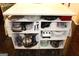 Kitchen island displaying storage solutions including shelving and appliance storage at 9342 Carillon Ct, Jonesboro, GA 30236
