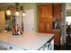 Kitchen island features quartz countertop with storage underneath, great for prepping and cooking at 9342 Carillon Ct, Jonesboro, GA 30236