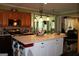 Open concept kitchen boasts a large island, stainless steel appliances, and modern lighting at 9342 Carillon Ct, Jonesboro, GA 30236